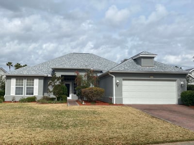 gray home with an architectural shingle roof