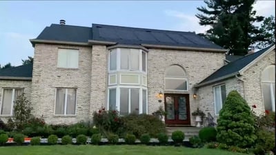 GAF solar energy shingle arrays on a 2 story brick house