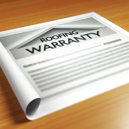 a piece of paper that says roofing warranty on it