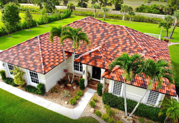 beautiful Florida style home with a synthetic tile roof
