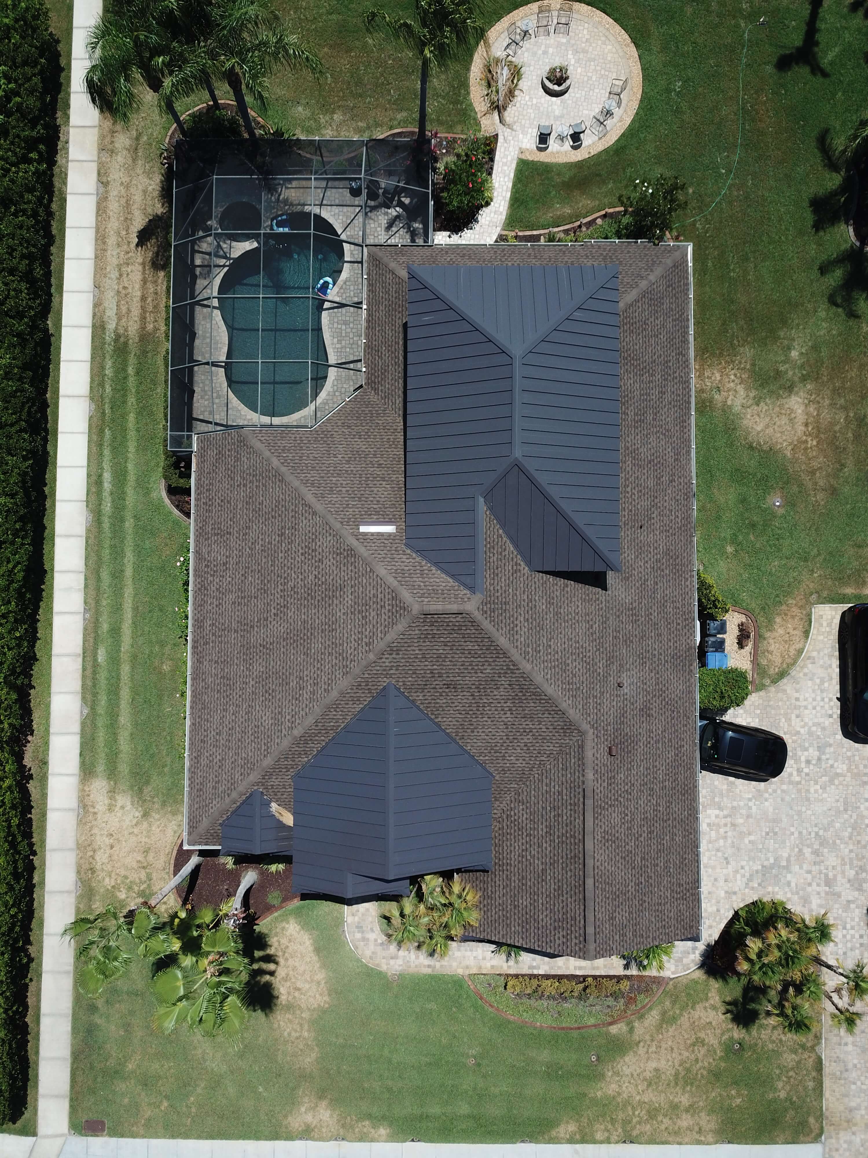 shingle roof replacement with metal accents