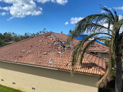 Spanish tile roof with extensive damage