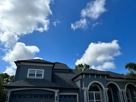 Dark grey home with a dark grey roof