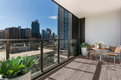 City skyline from a balcony roof with glass rails and a Dec-Tec roof