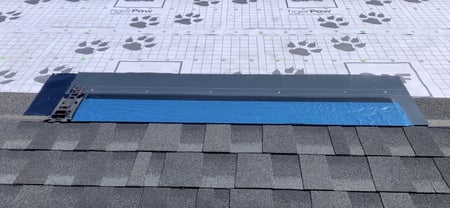 Solar shingle being installed on a roof