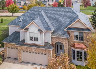 beautiful brick home with Ecostar synthetic slate roof and copper bay window