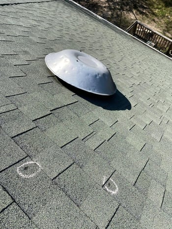 Power attic fan on a roof
