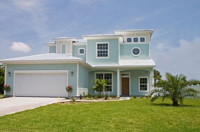 standing metal roof on a sea foam color Florida home