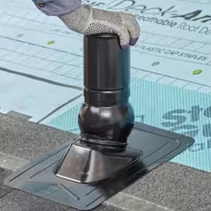 Slide the Pivot base flashing over the pipe 