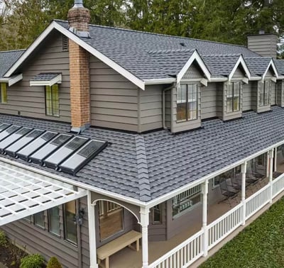 two-story home with a new GAF Timberline UHDZ shingle in Pewter gray