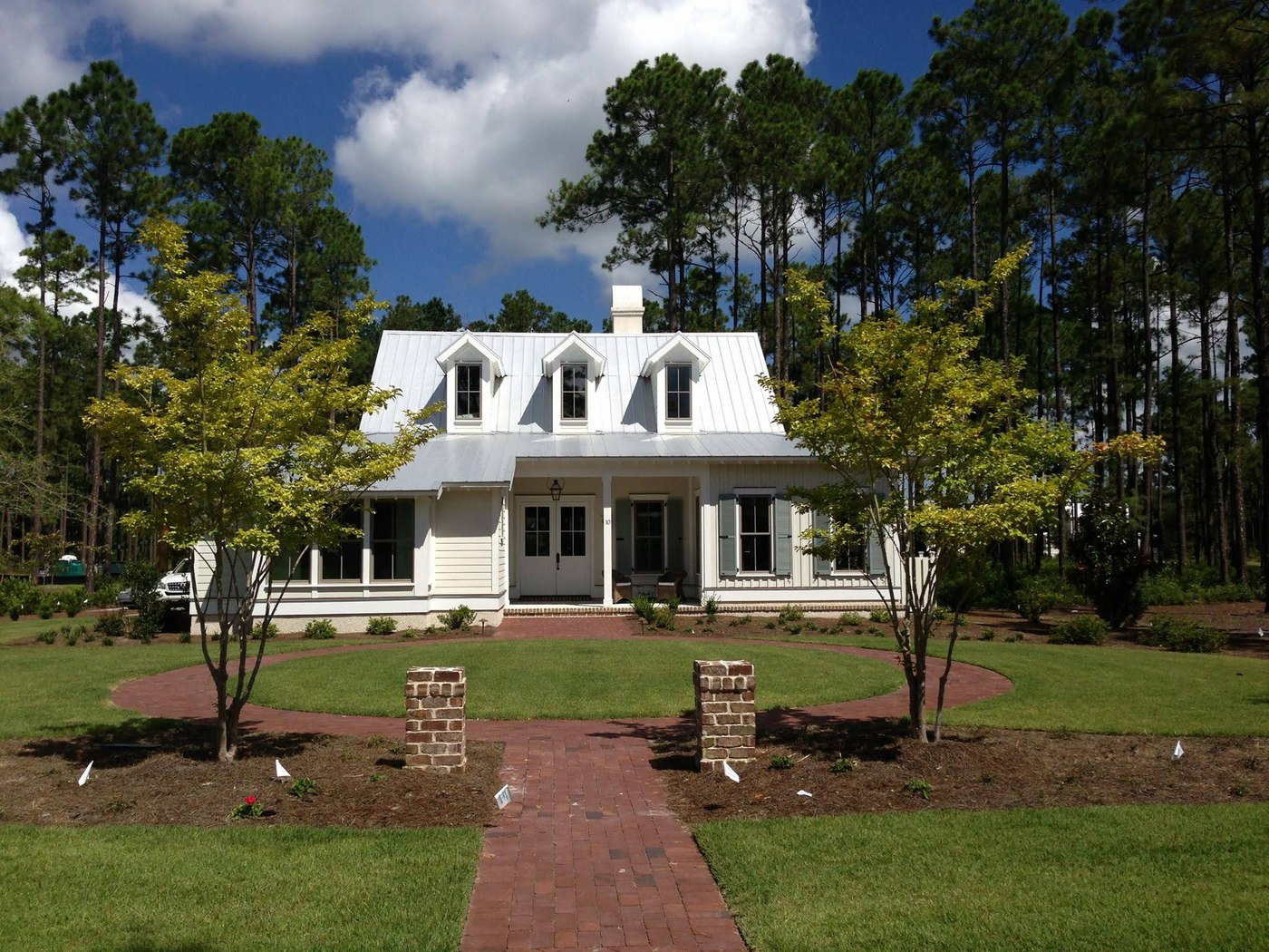 Country home with white metal roofing