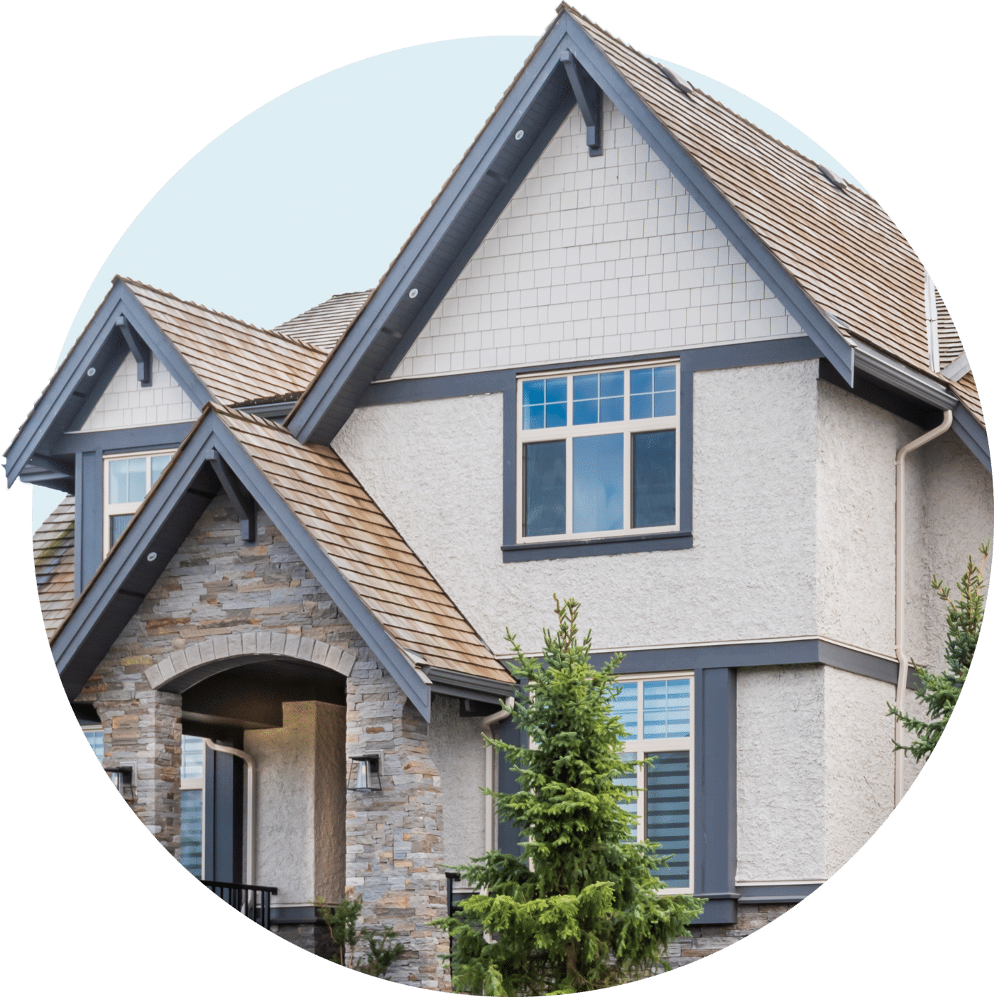 Stone home with a wood shingle roof