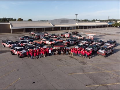 RoofCrafters team standing in front of RoofCrafters trucks-2