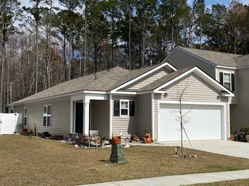 A single-story house with simple roof line with 3 tab shingles