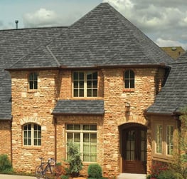 brick house with designer shingles