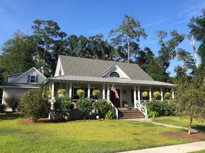 home with shingles and metal roofing-1