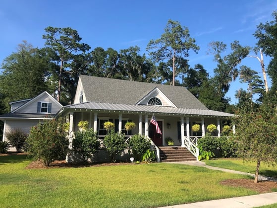 home with shingles and metal roofing-1