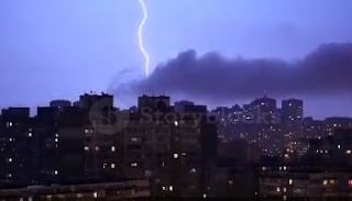 lightening in the sky with a Florida city scape in front