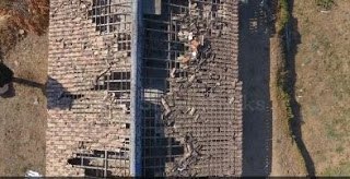 birds eye view of storm damaged roof