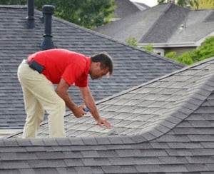 roofer performing inspection