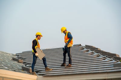 roofer meeting an adjuster to look at a roof