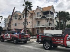 steep 4 story roof replacement in progress