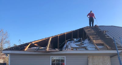 storm damaged roof being repaired