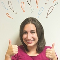 Smiling lady hold two thumbs up