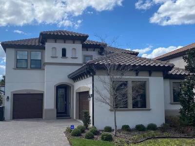 dark tile roofing on a stucco home