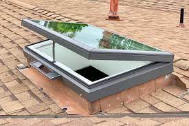 vented skylight on an asphalt shingle roof