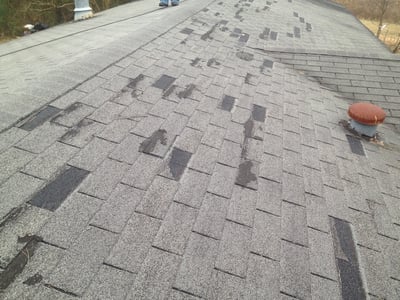 wind damage on a 3-tab shingle roof