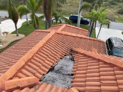 Old tile roof with a dead valley in the middle of hips