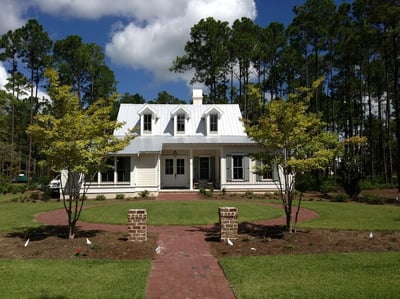 screw down metal roof home with dormers