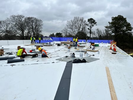 commercial roofing crew install TPO roof