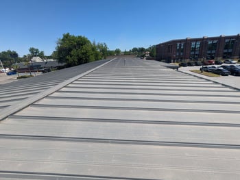 long commercial trapezoid metal roof on a commercial building
