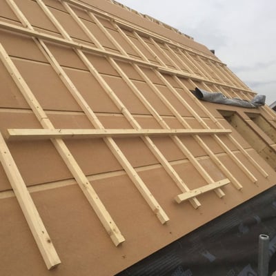 Wood nailers being installed on a roof