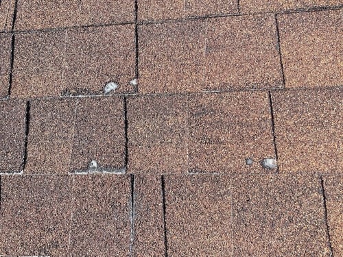 a sign of hail damage