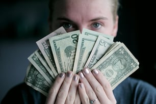 woman holding cash