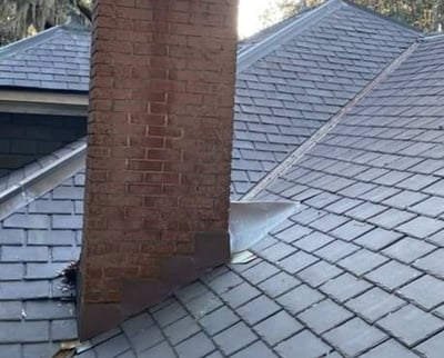 brick chimney on a synthetic slate roof-1