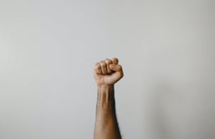 person showing strength with fist