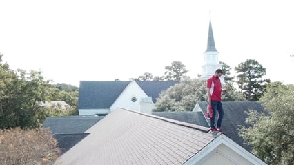 Kyle inspecting roof