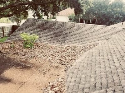 debris on a flat and shingle roof