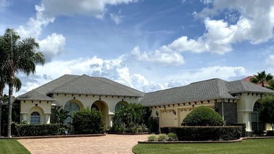 beautiful florida style home with designer shingles roof