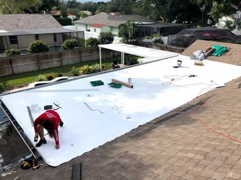 TPO roof being installed on a residential flat roof