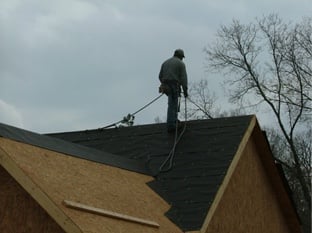 roofer using safety harness