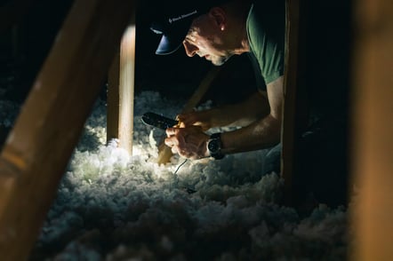 roofer analyzing insulation