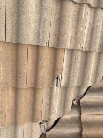 Spanish tile roof with hail damage