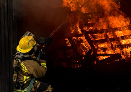 firefighter putting out fire