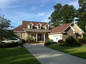 beautiful Low country brick home metal accents