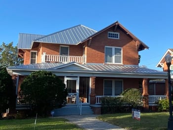 metal roof on brick home